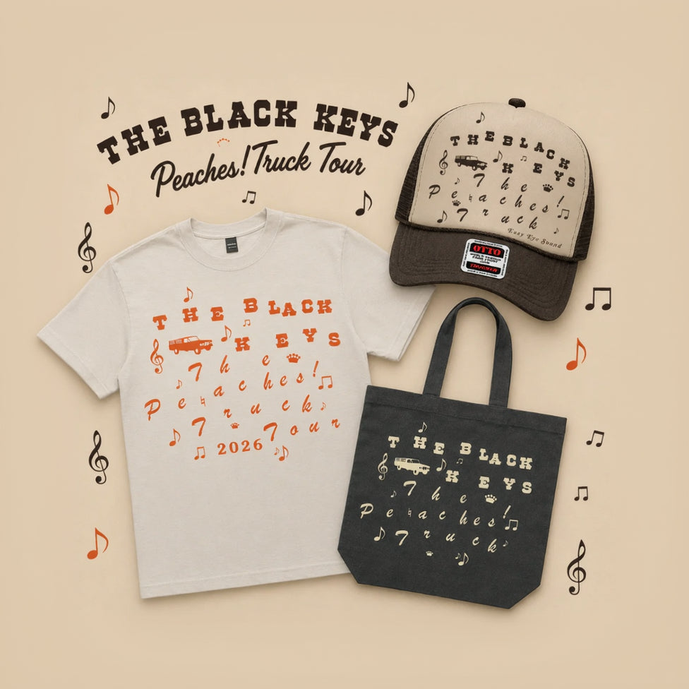 Black Keys merchandise including t-shirt, cap, and tote bag on a beige background with music notes.