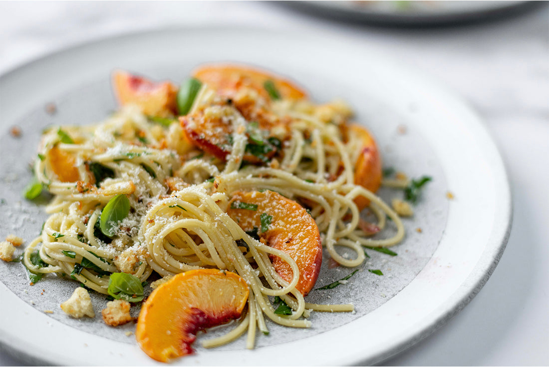 Roasted peaches within a spaghetti dish